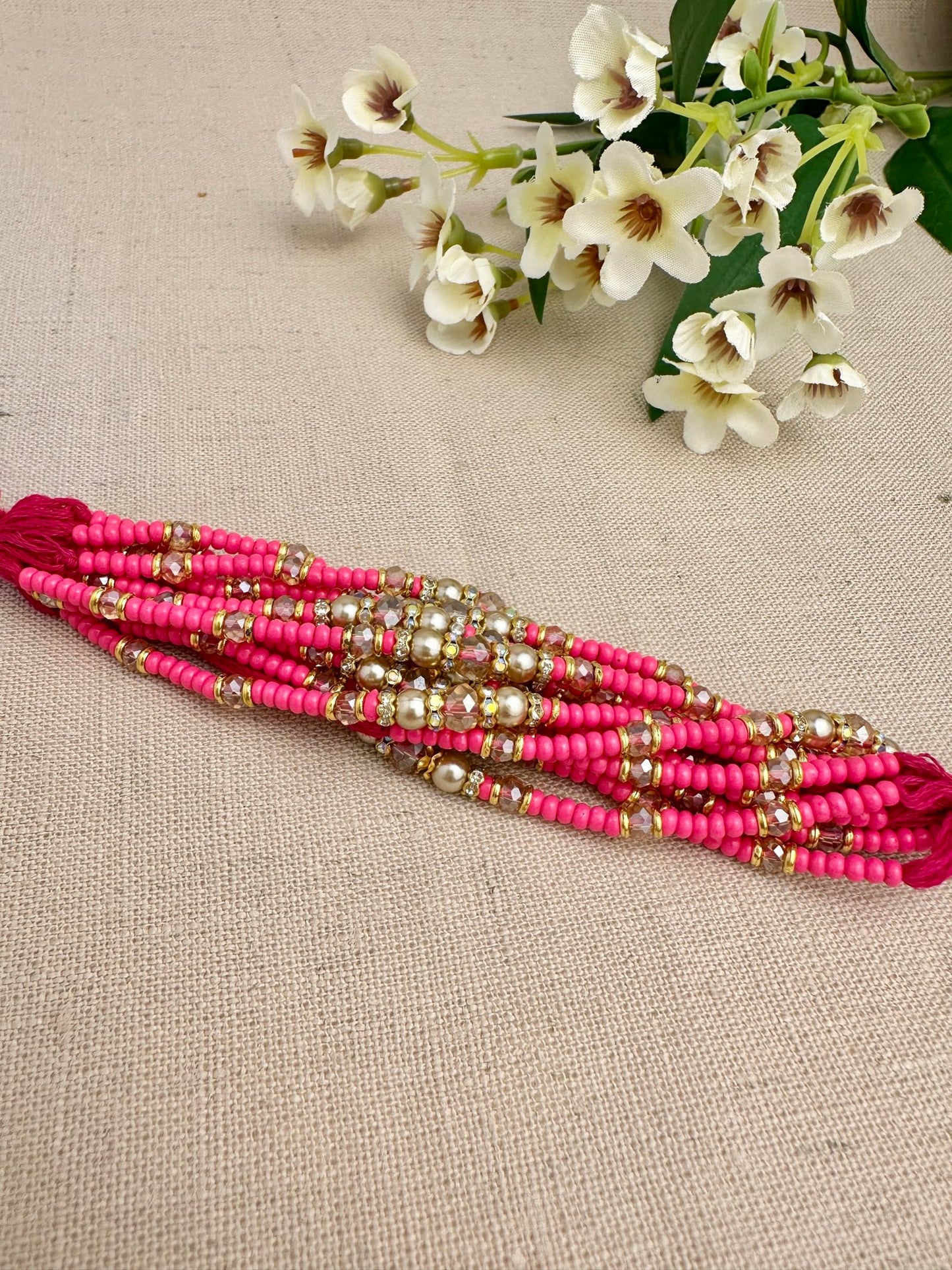 Close-up of pearl, crystal and gold-toned detailing on Noor Design 1 Rakhi dhagas