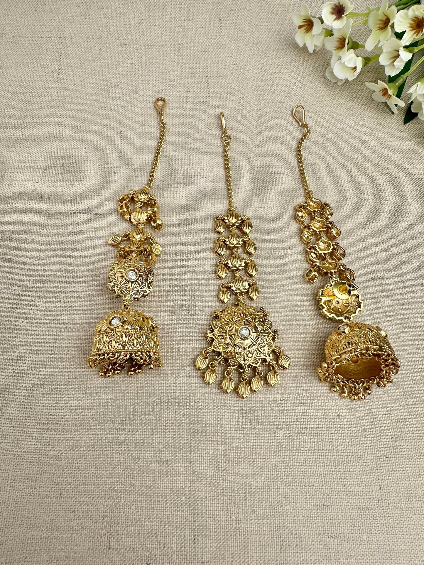 Back view of the Simran Gold-Plated Punjabi Jhumki & Tikka Set showing the sahara chain, earring backing and matching maang tikka.