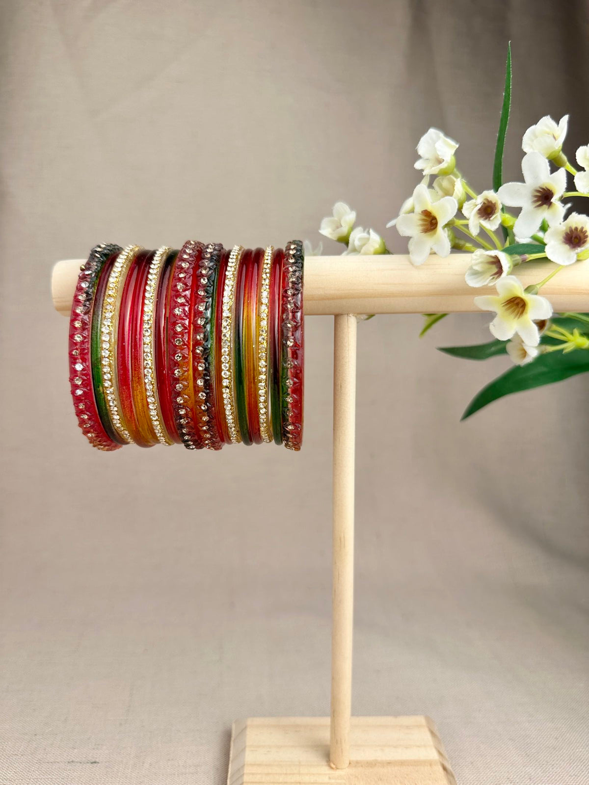 Dark Multi Aabha Glass Jelly Bangles Set featuring vibrant colours, sparkling decorative details and gold-toned accents.