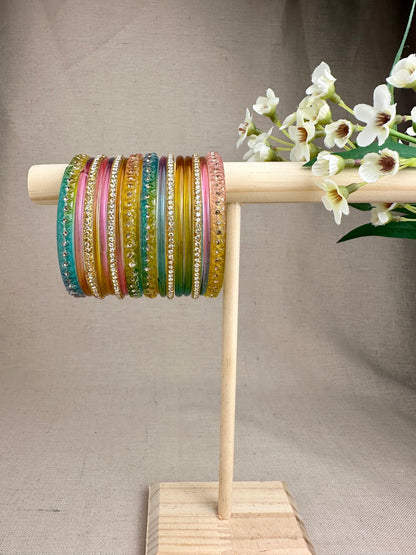 Aabha Pastel Multi Glass Jelly Bangles Set in soft pink, mint, aqua and yellow with decorative gold-toned details.