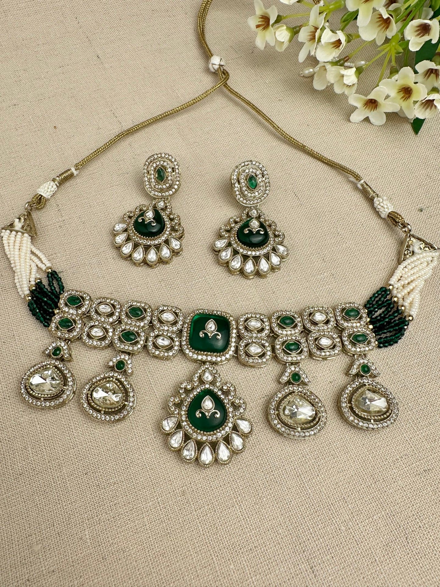 Close-up of Aarika Heritage kundan choker necklace and matching earrings