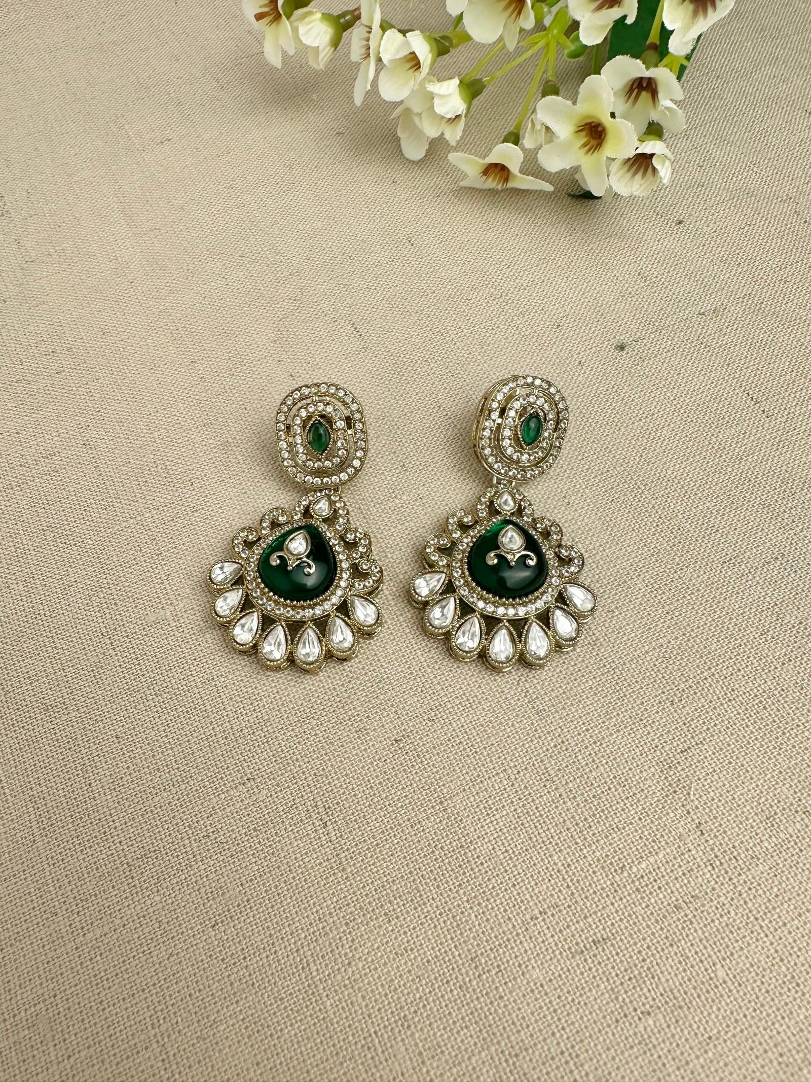 Close-up of matching kundan-style statement earrings from the Aarika set