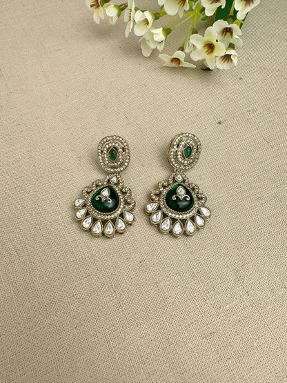 Close-up of matching kundan-style statement earrings from the Aarika set