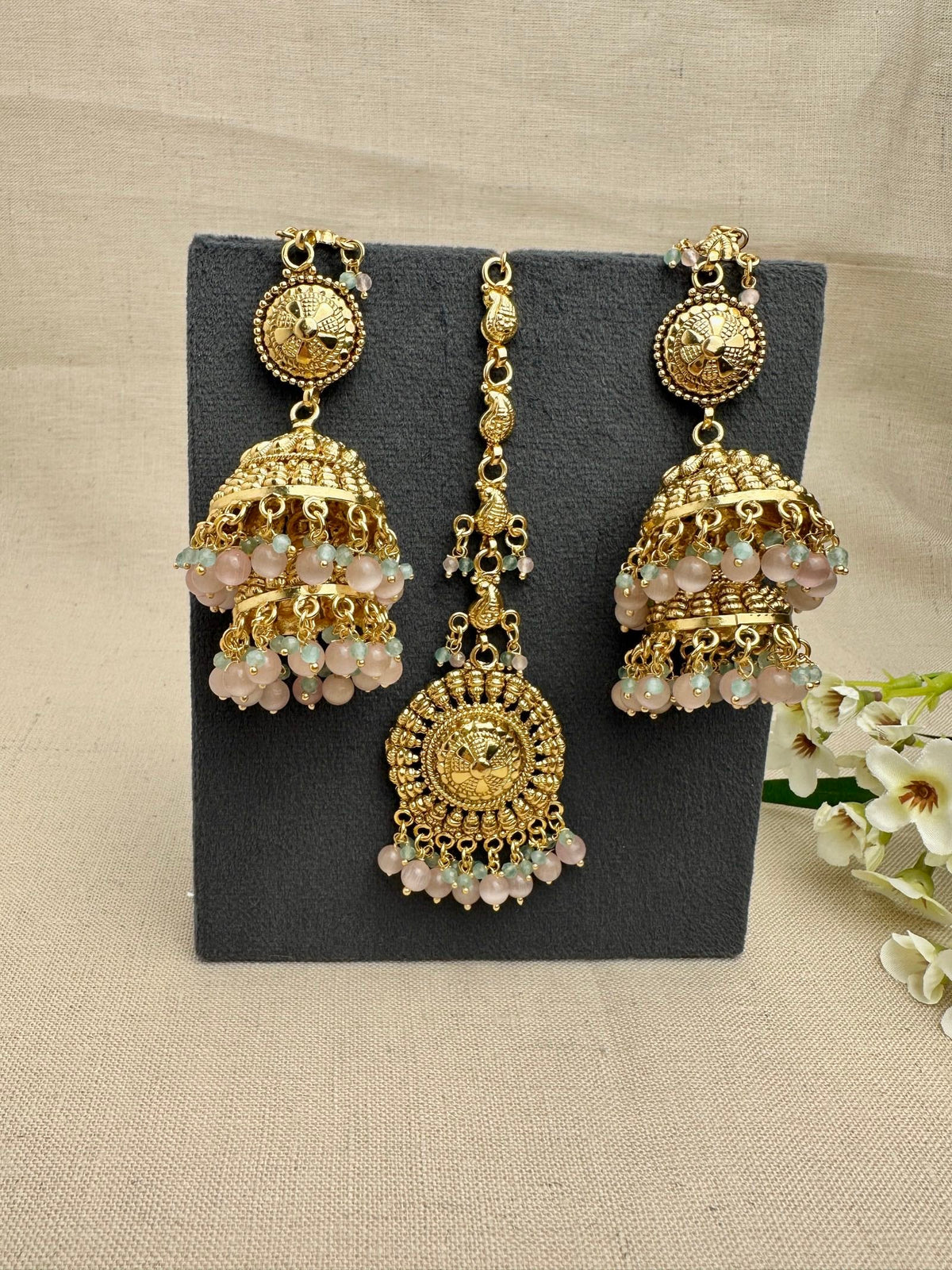 Aarohi Gold-Plated Punjabi Jhumki AND Tikka Set with pink and mint bead detailing.