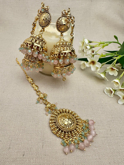Styled view of the Aarohi Gold-Plated Punjabi Jhumki AND Tikka Set with matching earrings and maang tikka.