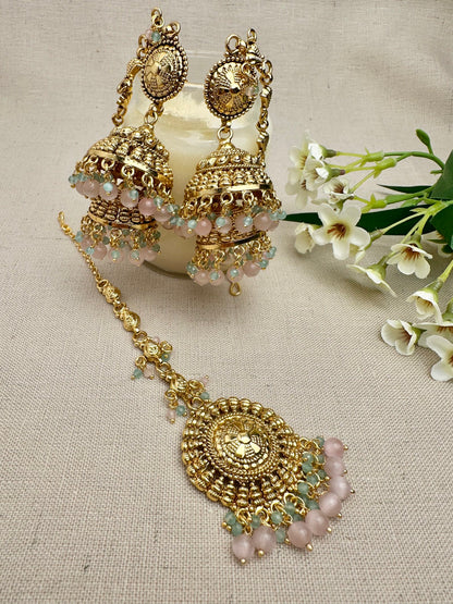 Styled view of the Aarohi Gold-Plated Punjabi Jhumki AND Tikka Set with matching earrings and maang tikka.