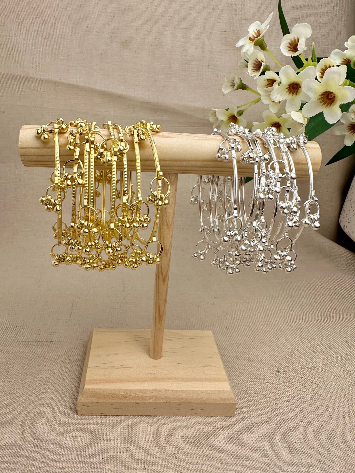 Aarohi Kashmiri Ghungroo Bangles in Gold and Silver displayed as sets of eight