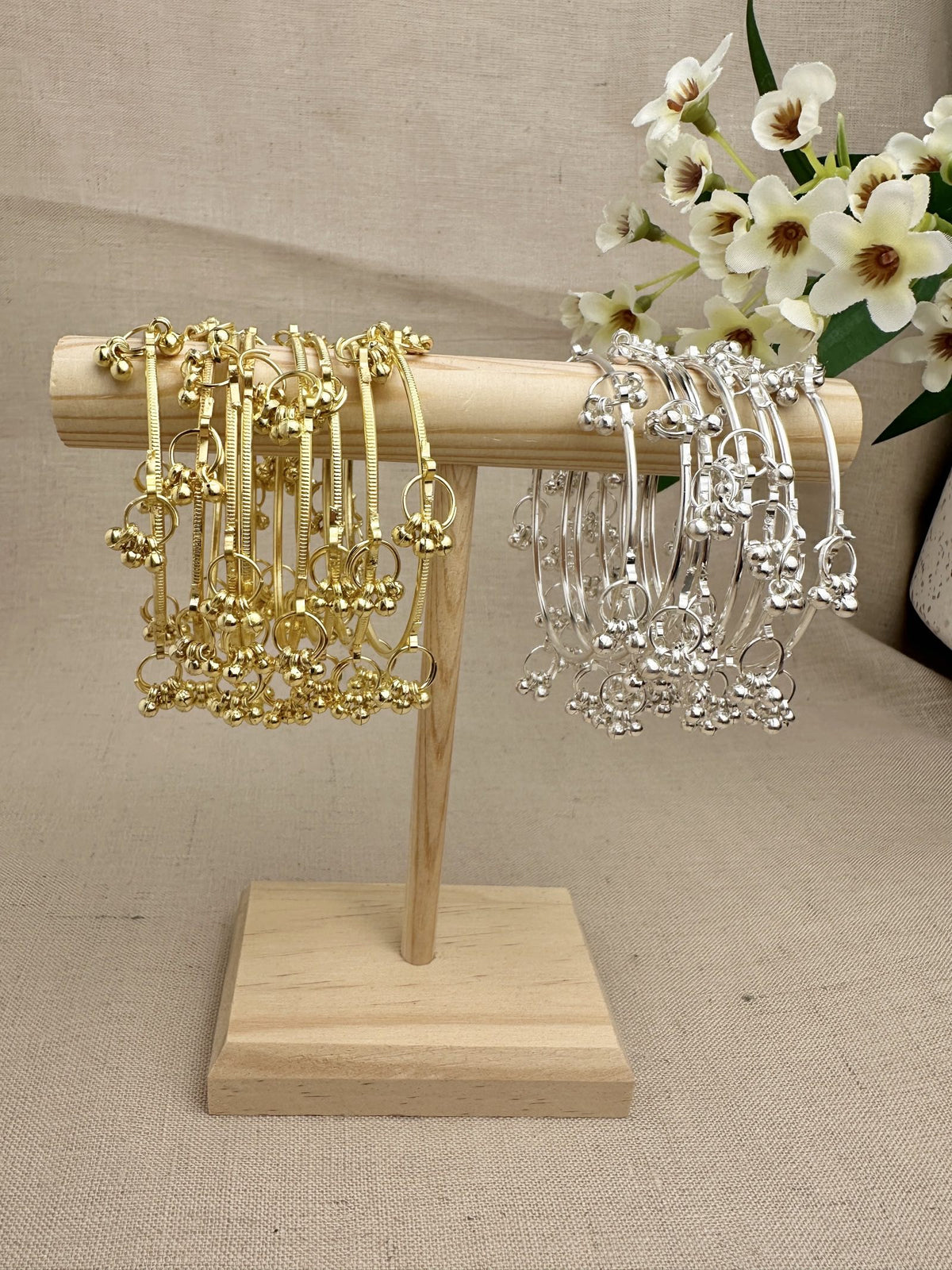 Aarohi Kashmiri Ghungroo Bangles in Gold and Silver displayed as sets of eight