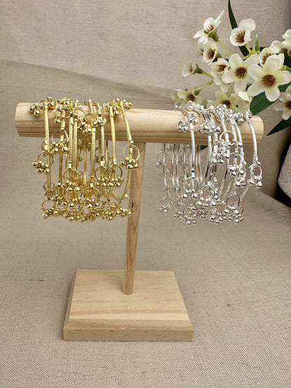 Aarohi Kashmiri Ghungroo Bangles in Gold and Silver displayed as sets of eight