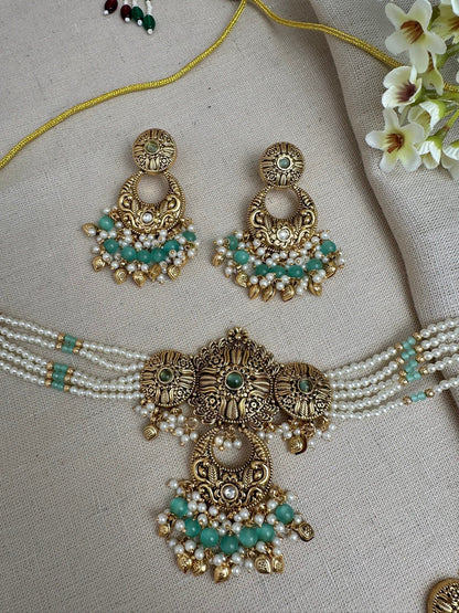     Close-up of Aarohi Mint Green antique gold pearl choker necklace