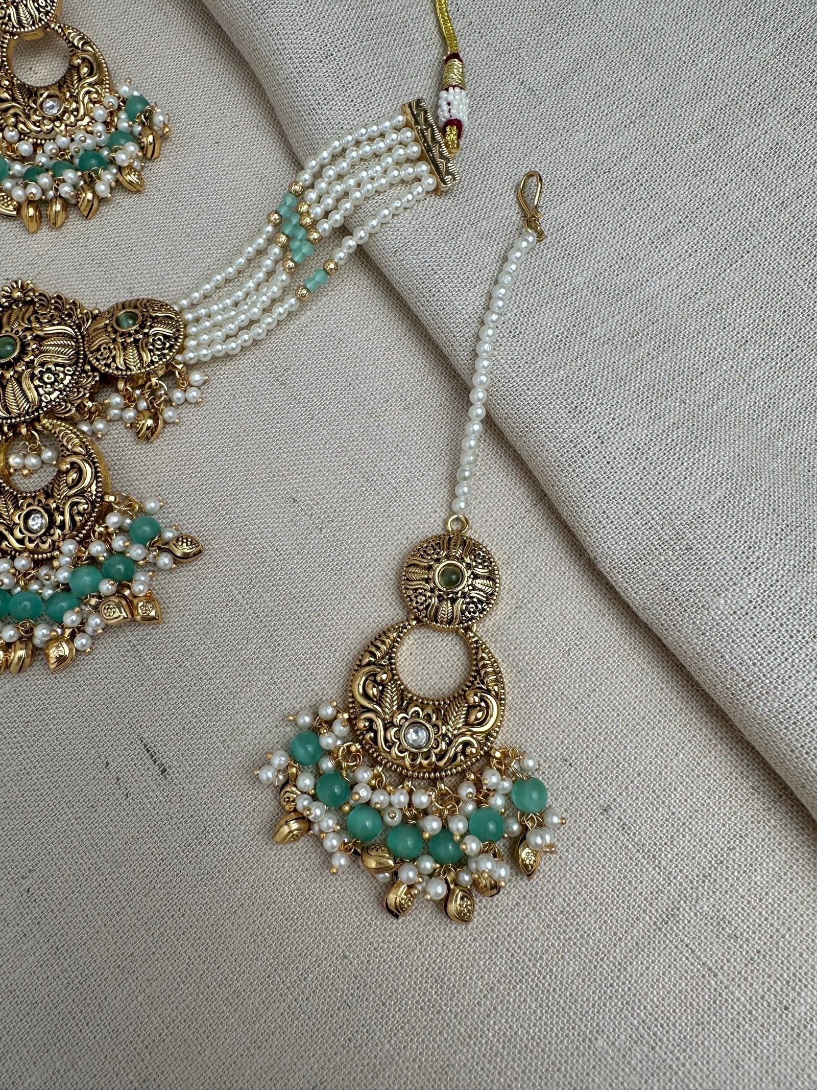     Mint Green antique gold maang tikka and matching earrings detail