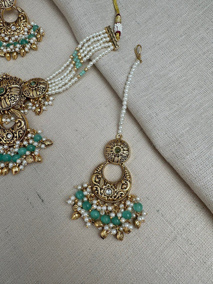    Mint Green antique gold maang tikka and matching earrings detail