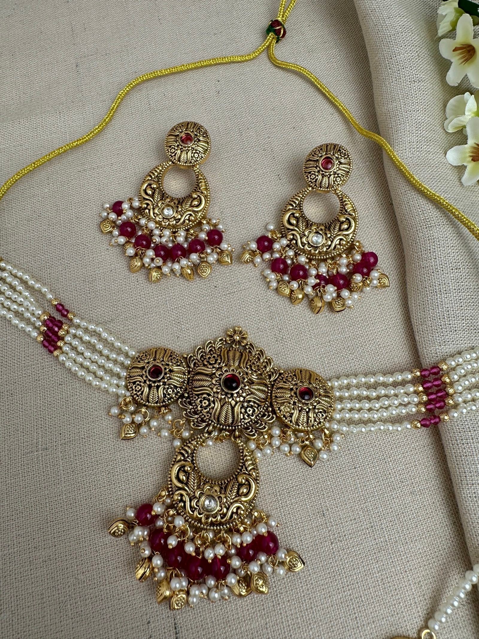     Close-up of Aarohi Ruby antique gold pearl choker necklace