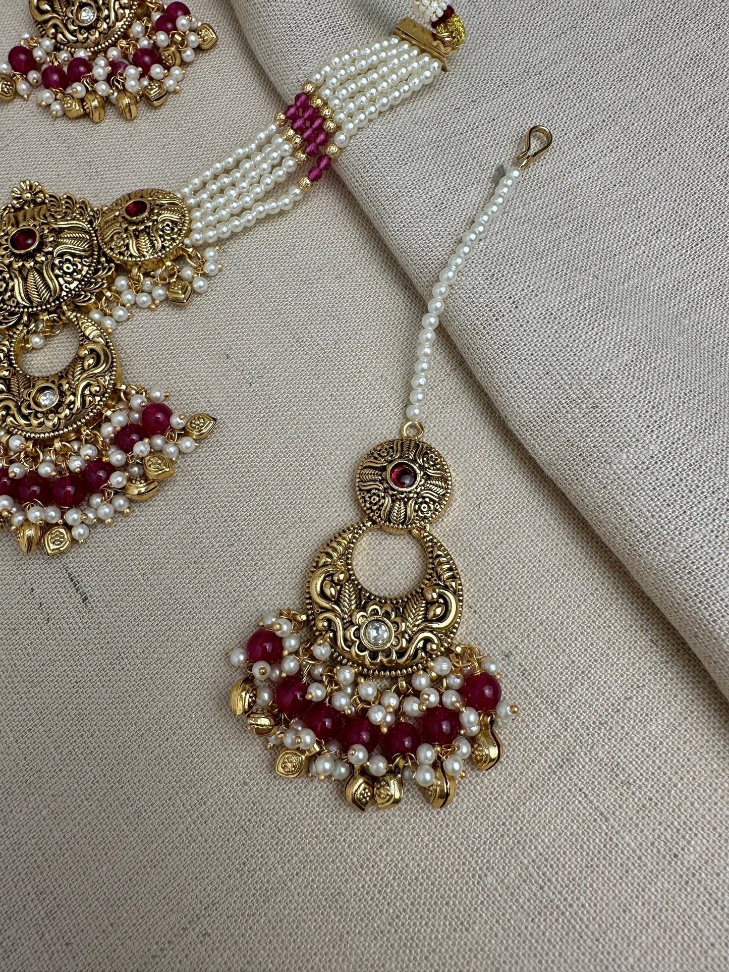     Ruby antique gold maang tikka and matching earrings detail