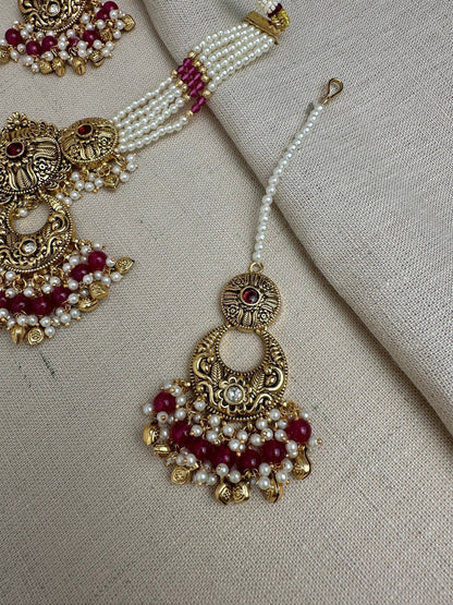     Ruby antique gold maang tikka and matching earrings detail