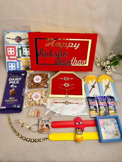 Complete Family Rakhi Gift Box with gifts for brother, bhabhi and children, chocolates, dry fruits, Ludo and reusable gift box.