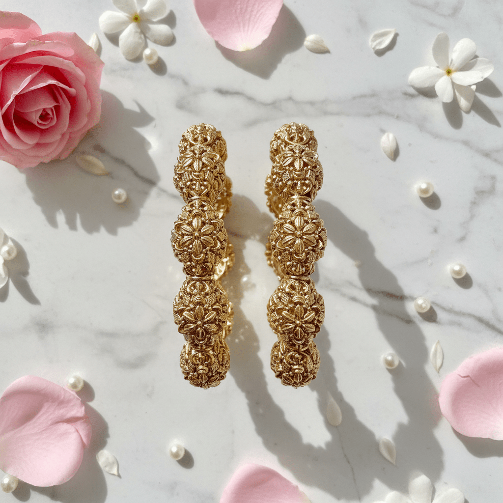 Divyansha kangan set flat lay with flower petals and pearls on marble