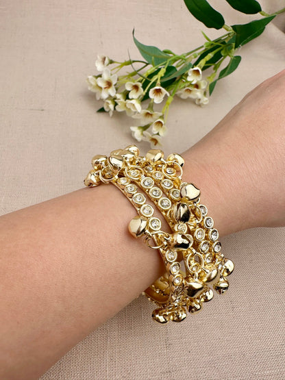 Gold stone ghungroo bangles set of four worn on wrist