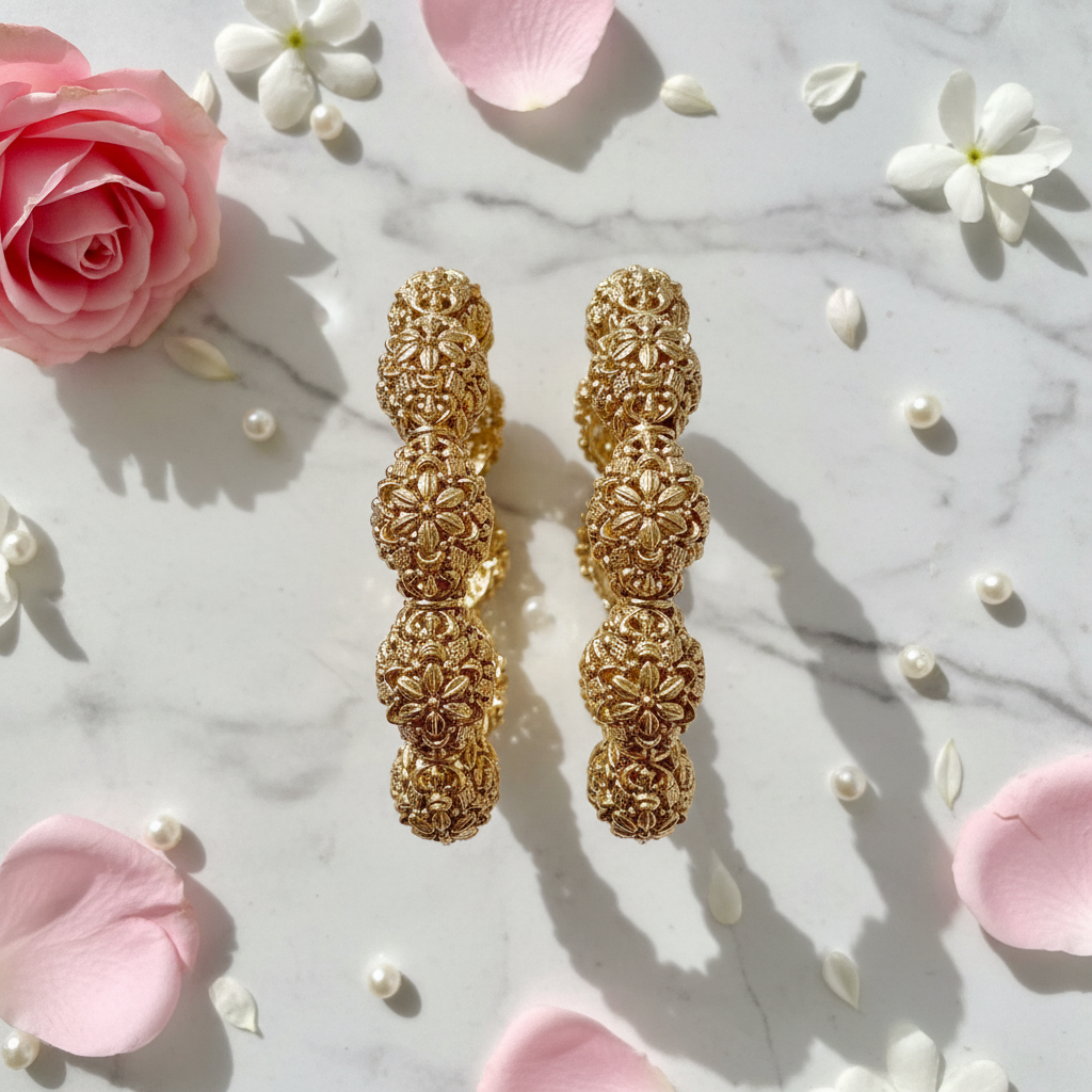 Divyansha kangan set flat lay with flower petals and pearls on marble