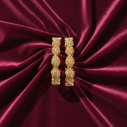 Divyansha kangan set on burgundy velvet with elegant draping