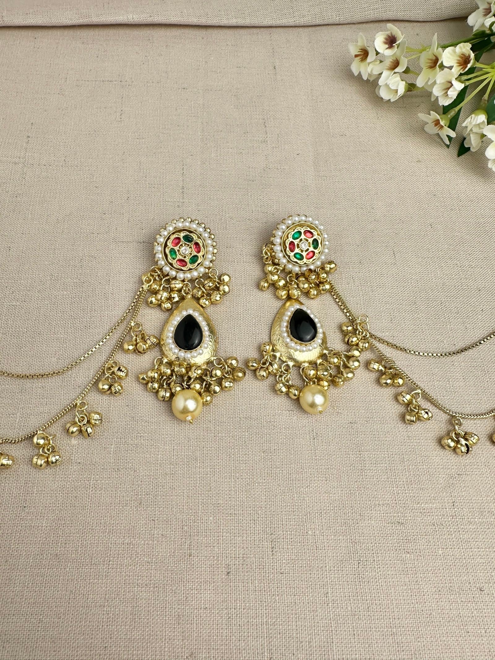     Close-up of Kanika Black Pachi Kundan earrings with pearl detailing