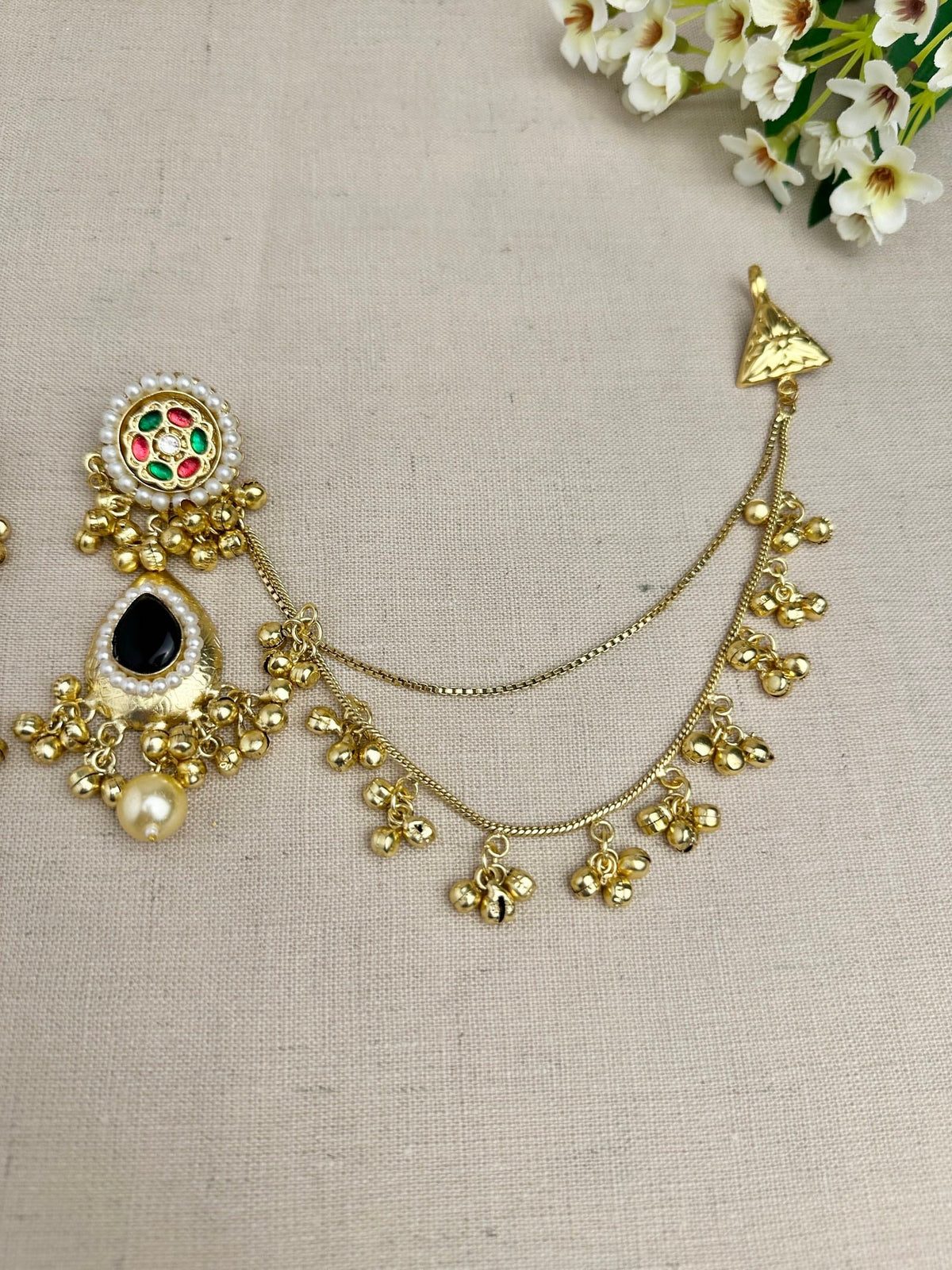     Black Kanika earring with attached gold-tone Sahara ear chain