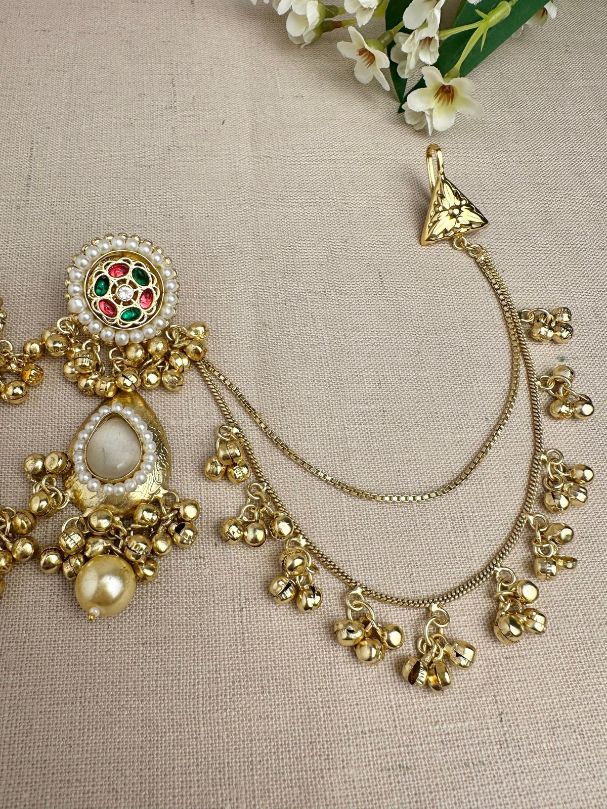     Attached Sahara ear-chain detail on Kanika Golden statement earrings