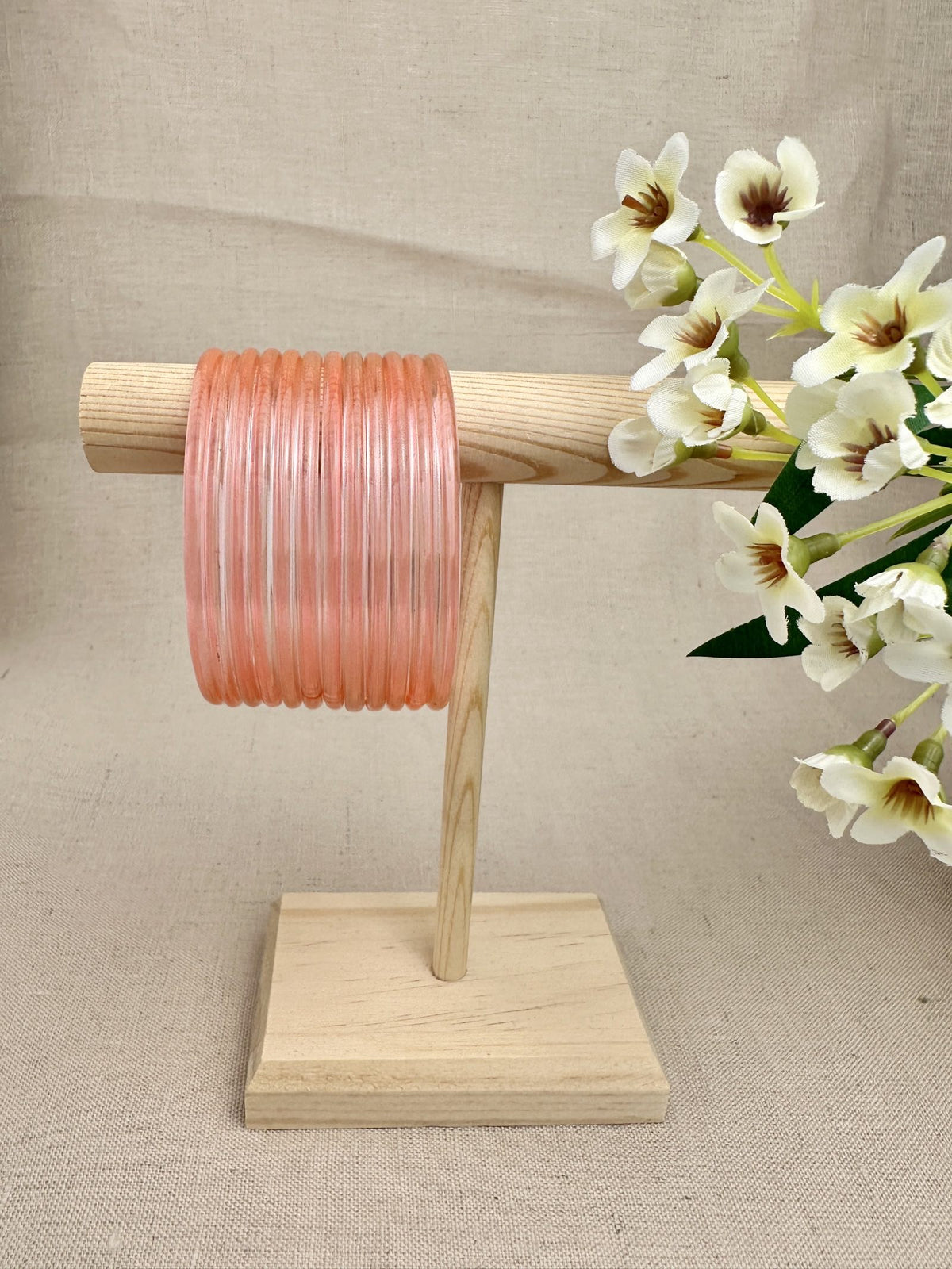 Peach Mayra Jelly Glass Bangles displayed as a set of 12