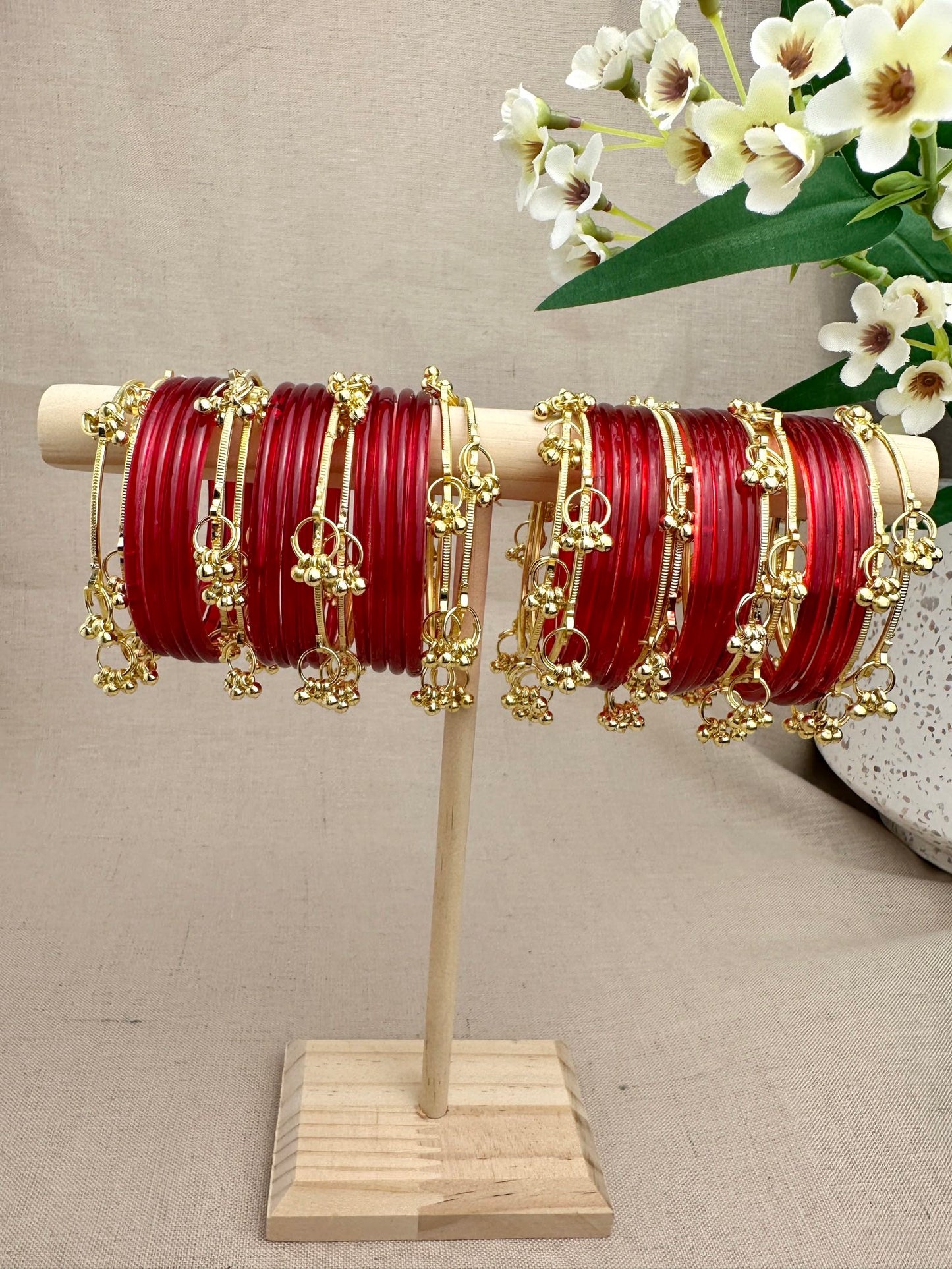 Mayra Jelly Glass Bangles styled with gold-tone Ghungroo Bangles for a layered festive look