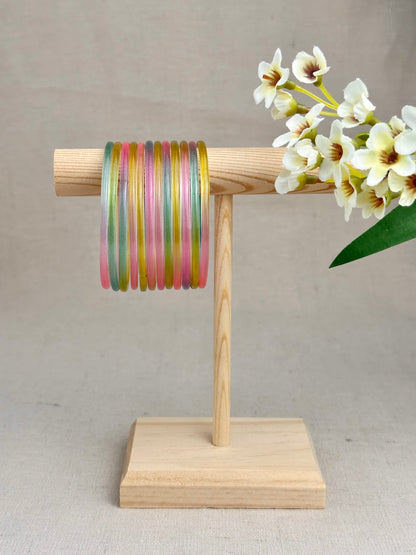 Mayra Pastel Multicolor Jelly Bangles featuring soft pink, mint green and yellow shades displayed on a wooden stand.