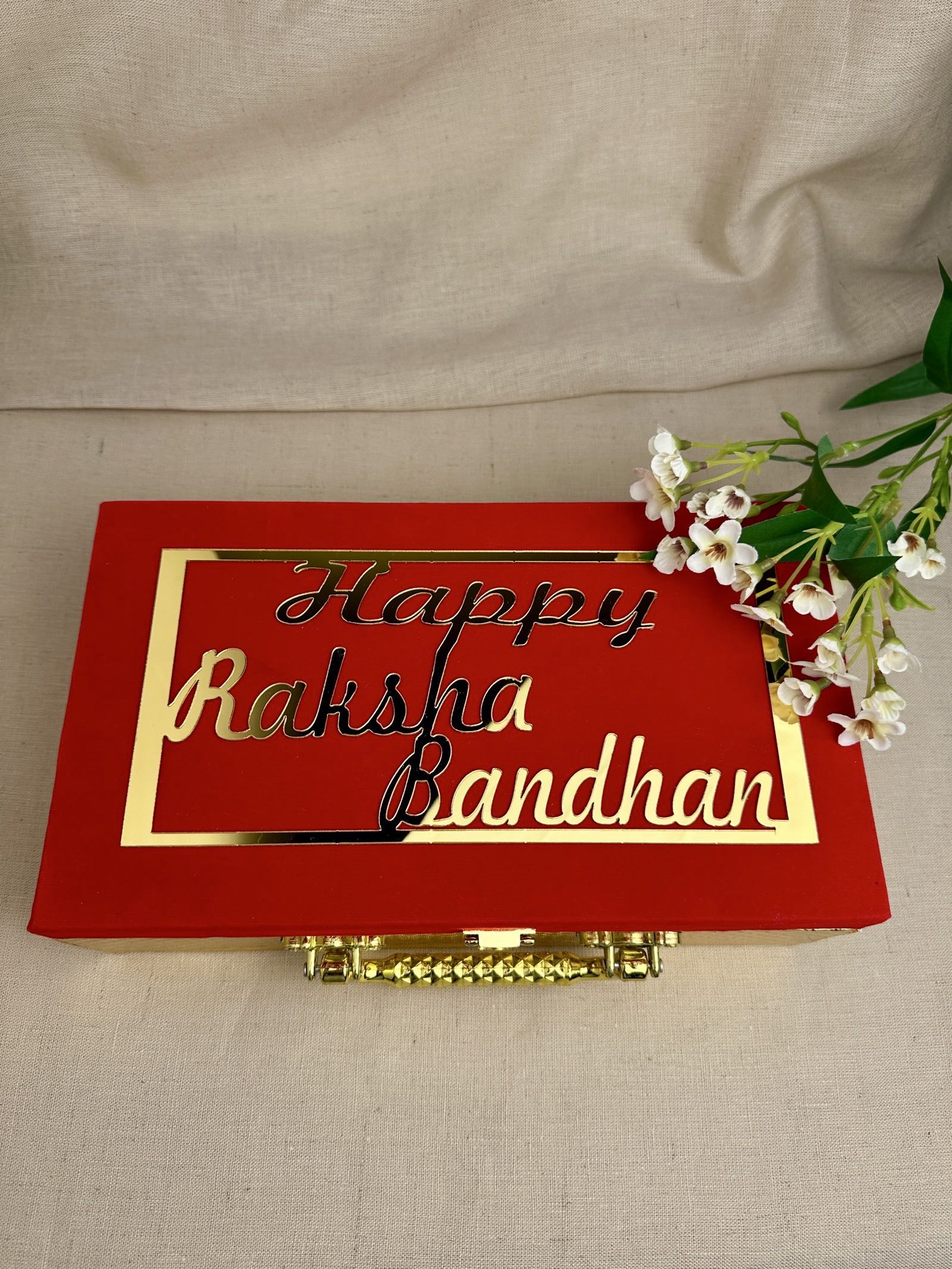 Premium reusable red Raksha Bandhan gift box with gold Happy Raksha Bandhan design