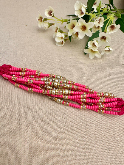Close-up of pearl, crystal and gold-toned detailing on Noor Design 1 Rakhi dhagas