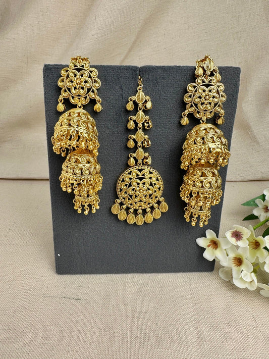 Noor gold-plated Punjabi triple jhumki earrings and medium tikka set in bright yellow gold