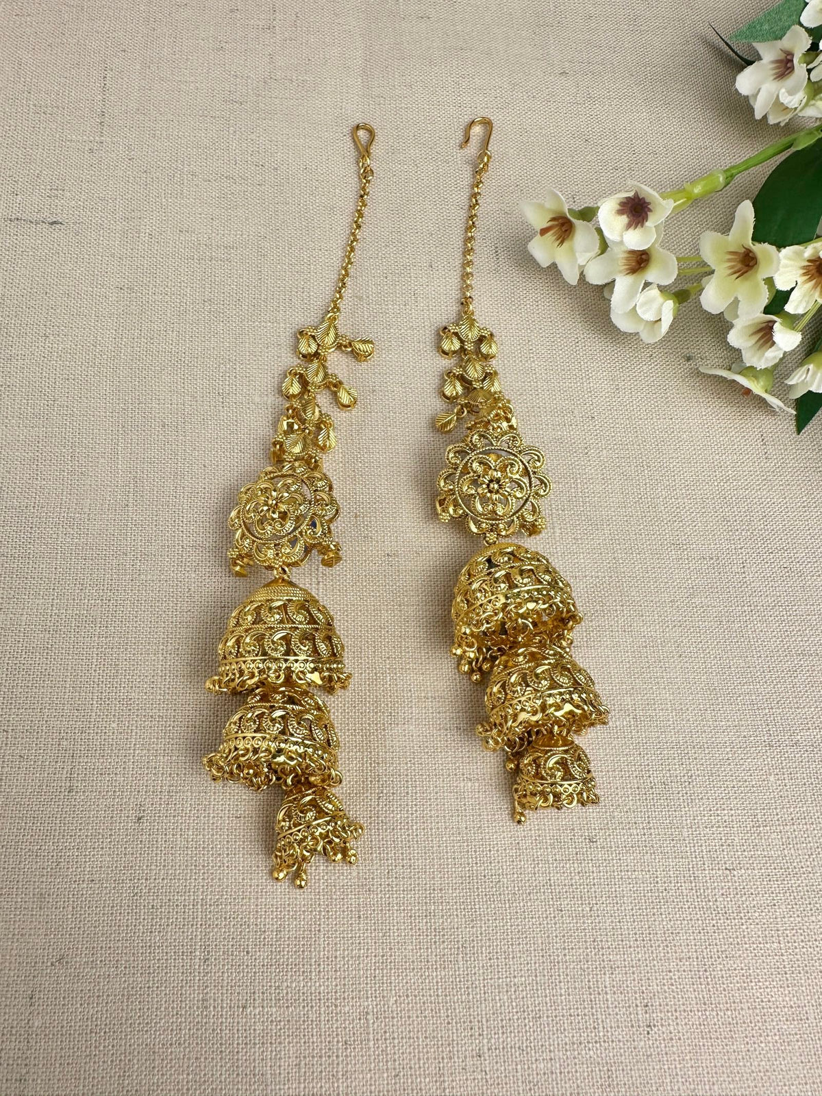 Gold-plated Punjabi triple jhumki earrings with attached ear Saharas