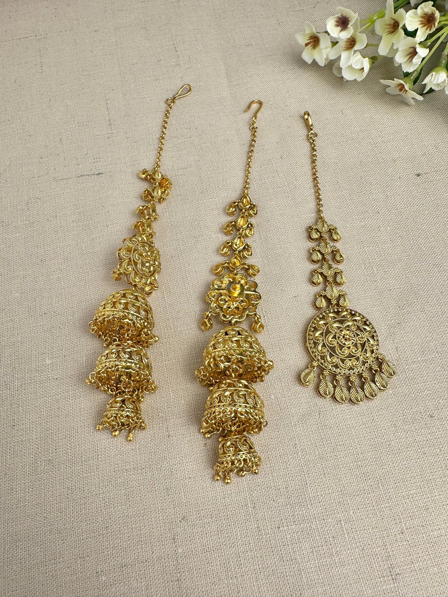Back view of Punjabi triple jhumki earrings showing push backs and ear Saharas