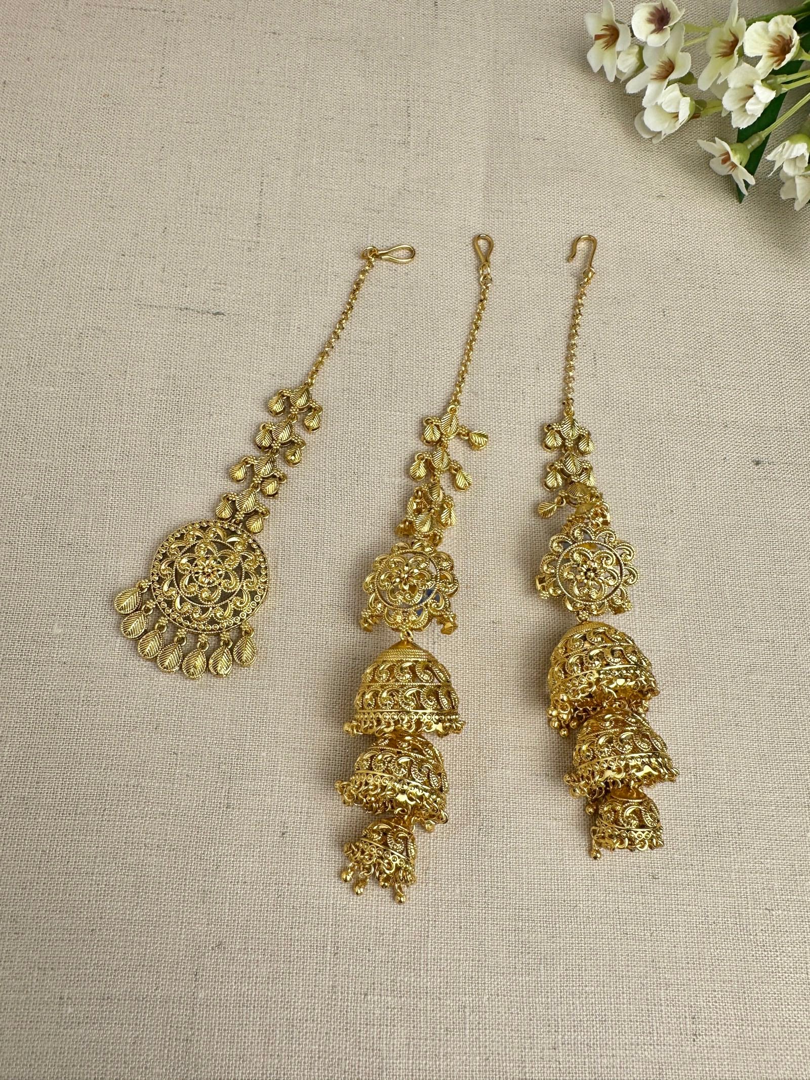 Bright yellow-gold-plated Punjabi triple jhumki earrings and matching medium tikka