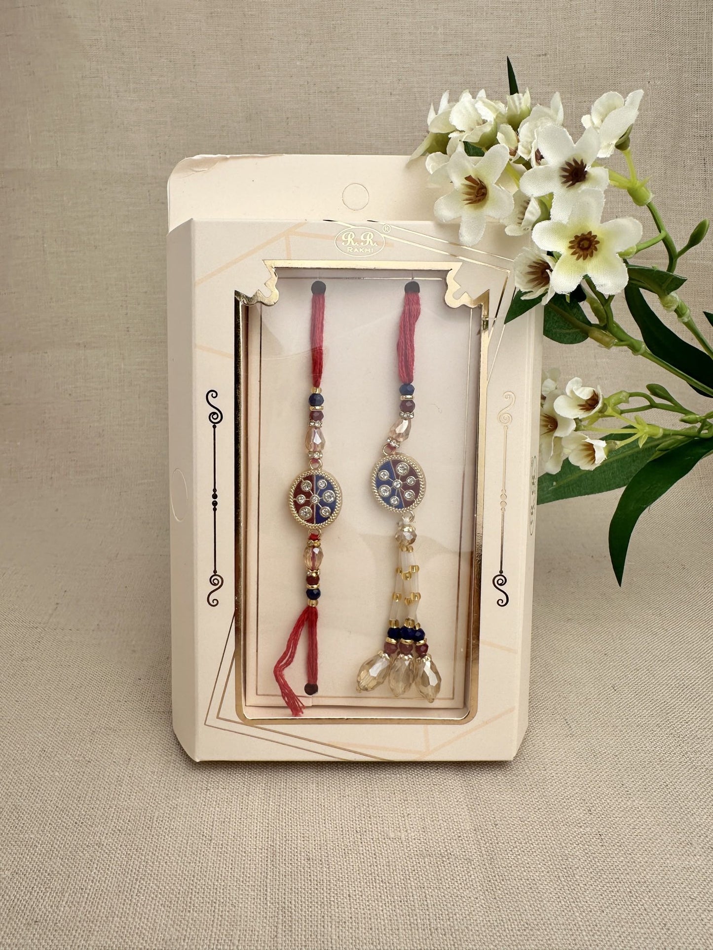 Royal-blue and burgundy crystal Rakhi with matching bhabhi lumba