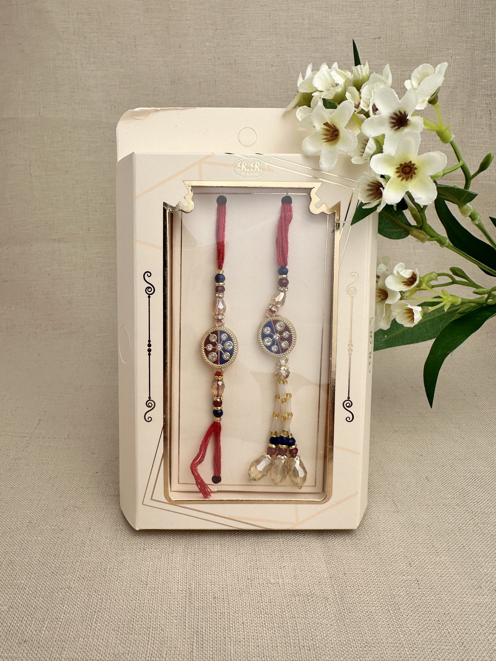 Royal-blue and burgundy crystal Rakhi with matching bhabhi lumba