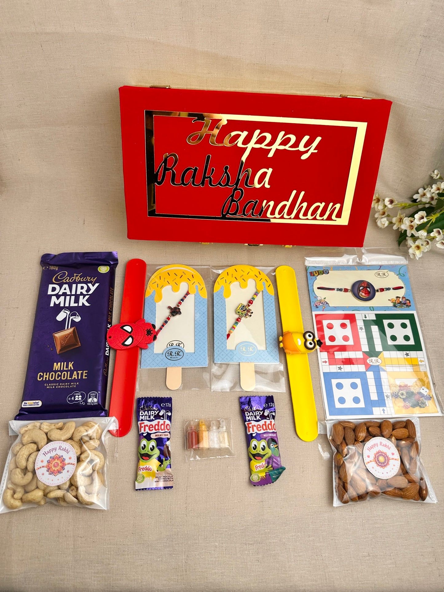 Rakhi Gift Box for 2 children with kids’ Rakhis, chocolates, dry fruits and festive gifts.