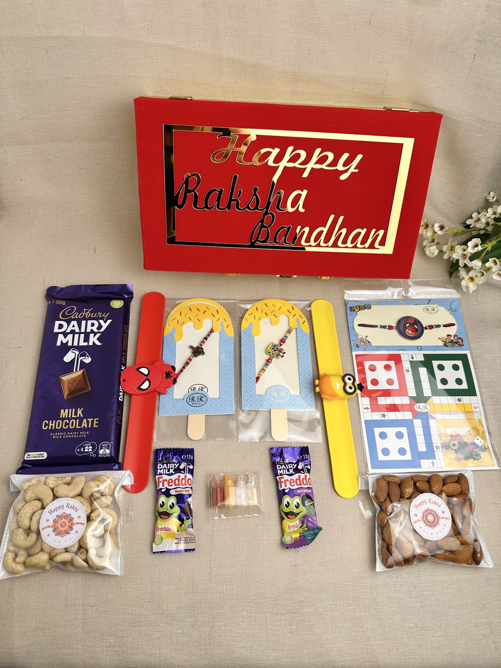 Rakhi Gift Box for 2 children with kids’ Rakhis, chocolates, dry fruits and festive gifts.
