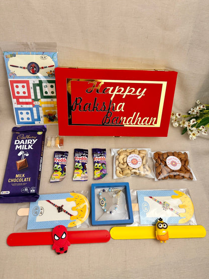 Rakhi Gift Box for 3 children with age-appropriate Rakhis, chocolates, dry fruits and gifts.