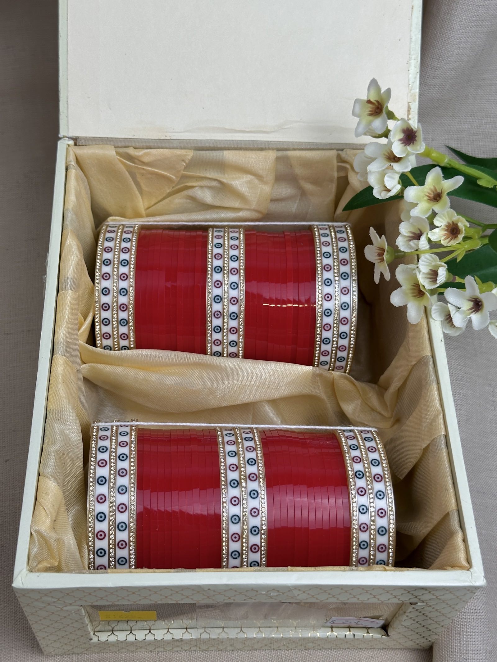     Complete red Punjabi chooda set for both arms arranged inside the included bridal box.