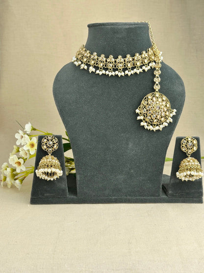 Saanjh champagne choker necklace with matching jhumkis and tikka