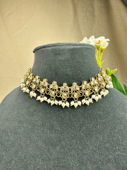 Close-up of Saanjh champagne stone choker with pearl-style drops