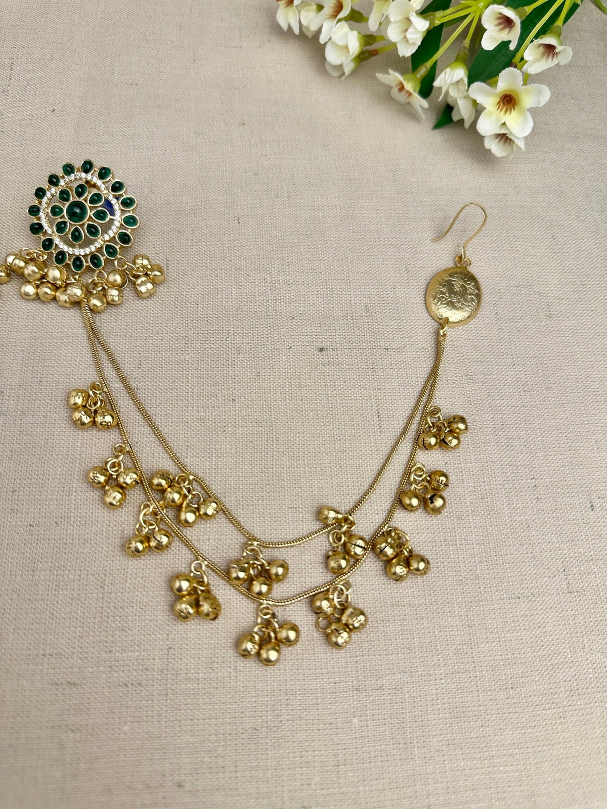     Close-up of Samaira green Kundan earrings with micro American Diamond detailing