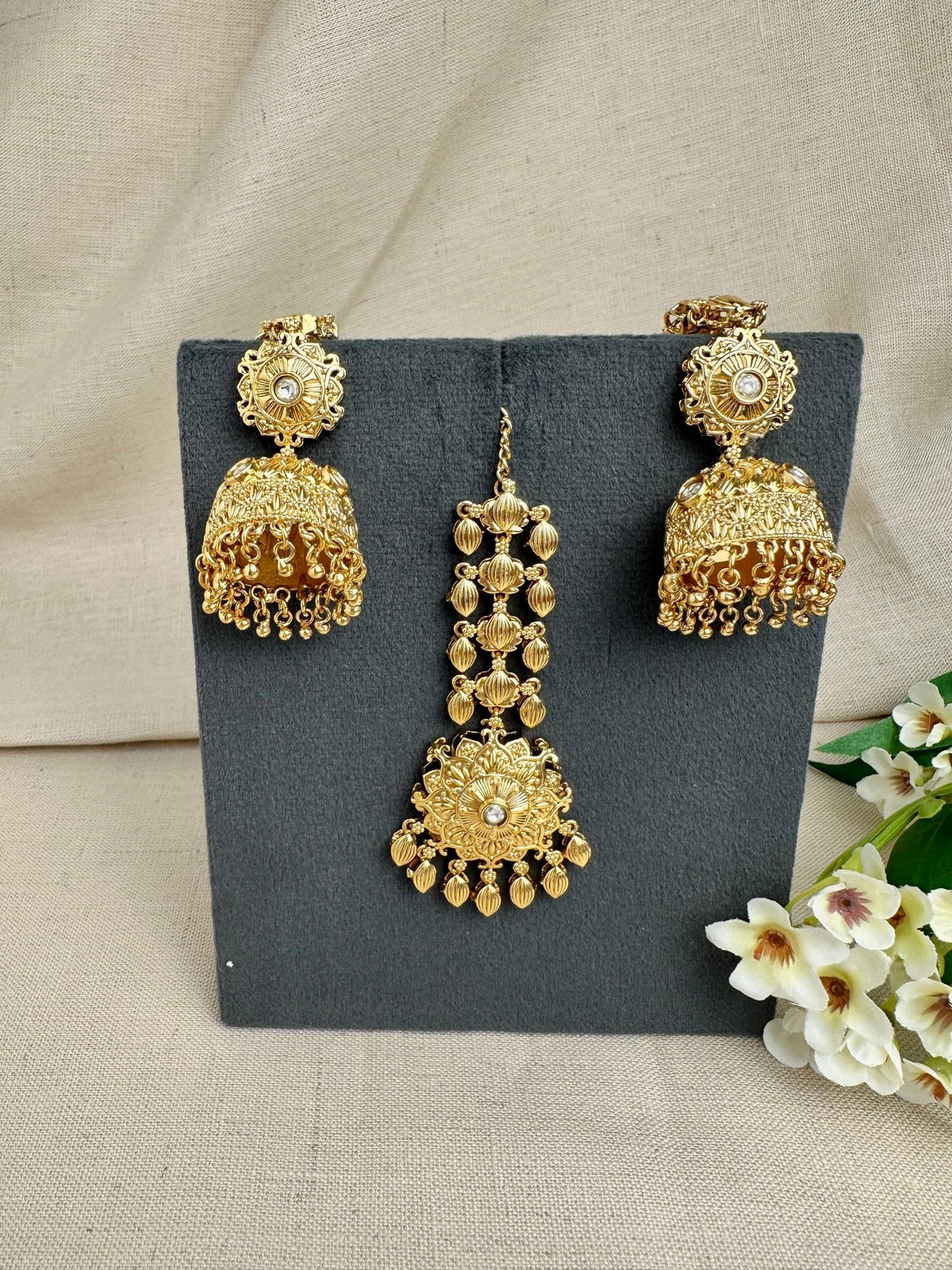 Simran Gold-Plated Punjabi Jhumki & Tikka Set featuring Kundan detailing, sahara earrings and matching maang tikka.