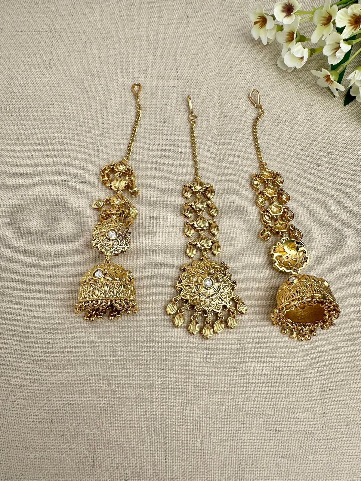 Back view of the Simran Gold-Plated Punjabi Jhumki & Tikka Set showing the sahara chain, earring backing and matching maang tikka.