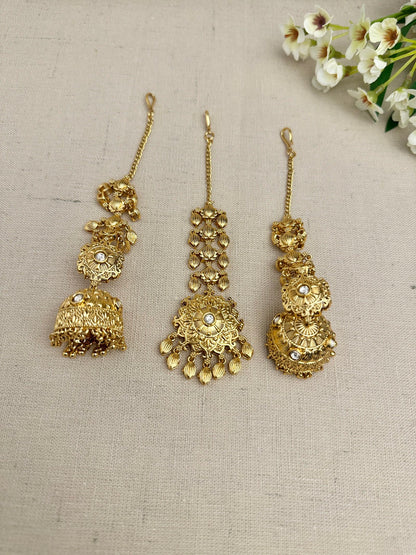 Side view of the Simran Gold-Plated Punjabi Jhumki & Tikka Set highlighting the single jhumki design and sahara chain.